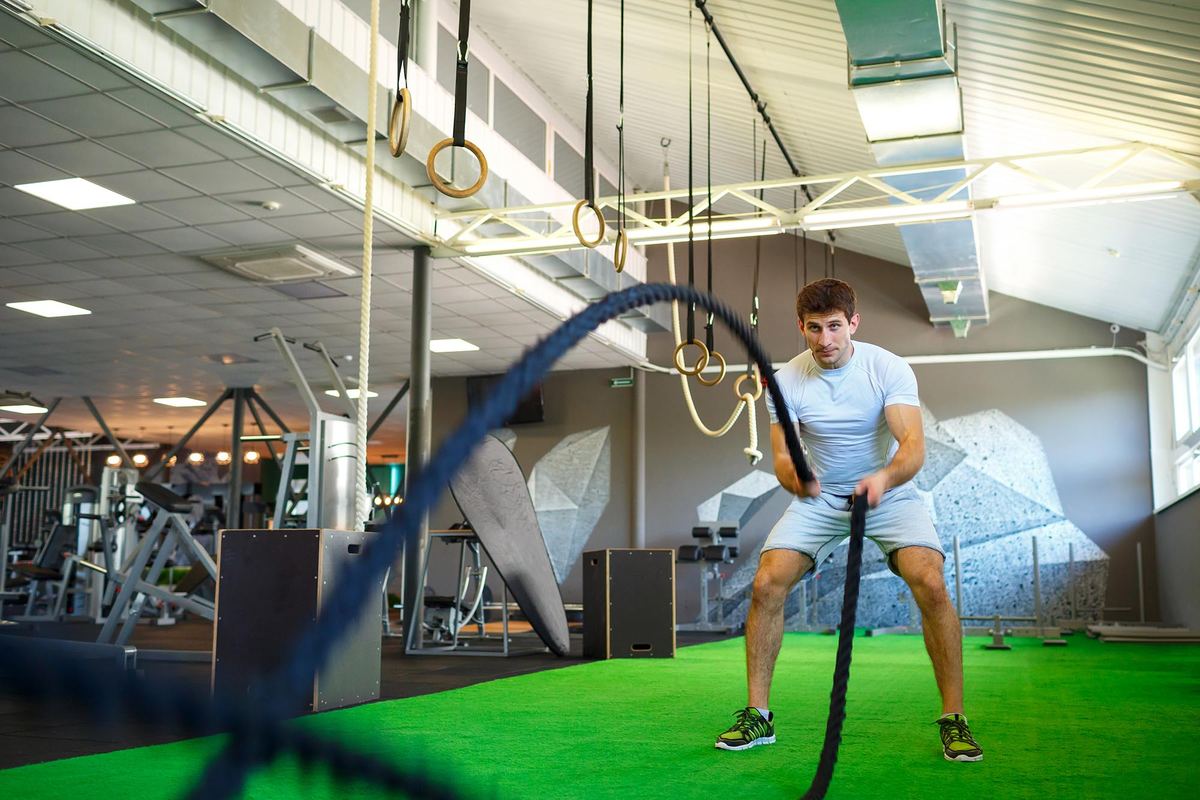 Man with battle rope in functional training